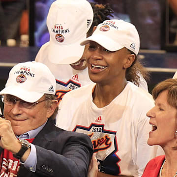 Oct 12, 2012; Indianapolis, IN, USA; Fever owner Herb Simon gets a look at the WNBA trophy with standout Tamika Catchings, center, and team COO Kelly Krauskopf after an 87-78 win over the Lynx. The Indiana Fever hosted the Minnesota Lynx in game four of the WNBA Finals at Bankers Life Fieldhouse. Mandatory Credit: Mike Fender-USA TODAY NETWORK  