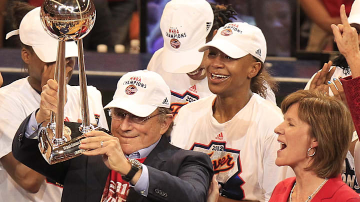 Oct 12, 2012; Indianapolis, IN, USA; Fever owner Herb Simon gets a look at the WNBA trophy with standout Tamika Catchings, center, and team COO Kelly Krauskopf after an 87-78 win over the Lynx. The Indiana Fever hosted the Minnesota Lynx in game four of the WNBA Finals at Bankers Life Fieldhouse. Mandatory Credit: Mike Fender-USA TODAY NETWORK  