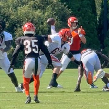 Bengals rookie stumbles before going into quarterback Joe Burrow's legs.