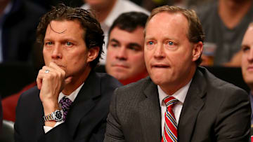 Former Atlanta Hawks head coach Mike Budenholzer and assistant Quin Snyder look on against the Brooklyn Nets.