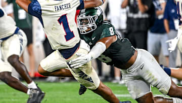 Michigan State's Anthony Jones, right, tackles Florida Atlantic's Cam Fancher during the fourth quarter on Friday, Aug. 30, 2024, at Spartan Stadium in East Lansing.