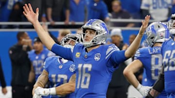 Detroit Lions quarterback Jared Goff raises his arms as the Lions beat the L.A. Rams, 24-23, in the
