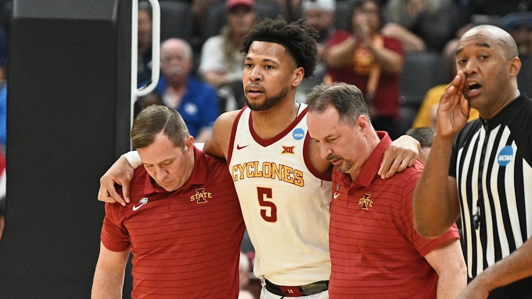 Mar 20, 2026; St. Louis, MO, USA; Iowa State Cyclones forward Joshua Jefferson (5) is helped off of the court after suffering an apparent injury to his left leg while shooting a layup against Tennessee State Tigers forward Jalen Pitre (not pictured) during the first half of a first round game of the men's 2026 NCAA Tournament at Enterprise Center. Mandatory Credit: Jeff Le-Imagn Images