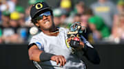 Oregon infielder Sabin Ceballos throws to first for an out in the first inning during an NCAA college baseball tournament Super Regional game Saturday, June 10, 2023, in Eugene, Ore. Oral Roberts won 8-7.