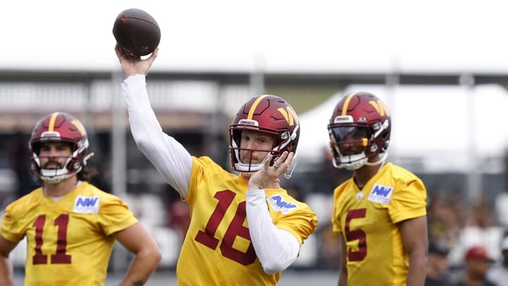 Jul 26, 2024; Ashburn, VA, USA; Washington Commanders quarterback Jeff Driskel (16) passes the ball on day three of training camp at Commanders Park. Mandatory Credit: Geoff Burke-USA TODAY Sports