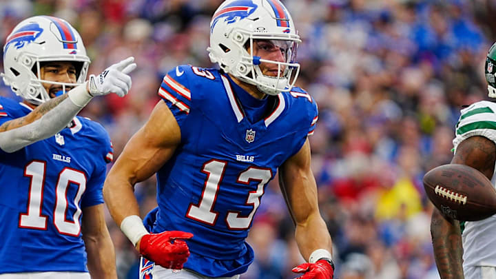 Buffalo Bills wide receiver Khalil Shakir (10) and Buffalo Bills wide receiver Mack Hollins (13) celebrate yards gained on a pass during first half action at the Bills home game against the New York Jets at Highmark Stadium in Orchard Park on Dec. 29, 2024.