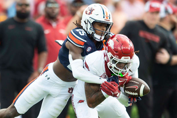 Auburn Tigers defensive back Champ Anthony (25) breaks up a pass intended for Arkansas Razorbacks wide receiver Tyrone Broden