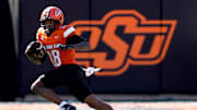 Oklahoma State's Sam Jackson V (18) rushes in the first half of the college football game between the Oklahoma State Cowboys and the Baylor Bears at Boone Pickens Stadium in Stillwater, Okla., Saturday, Sept. 27, 2025.