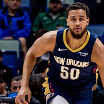 Feb 23, 2025; New Orleans, Louisiana, USA;  New Orleans Pelicans forward Jeremiah Robinson-Earl (50) brings the ball up court against San Antonio Spurs guard Stephon Castle (5) during the first half at Smoothie King Center. Mandatory Credit: Stephen Lew-Imagn Images
