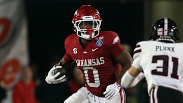 Dec 27, 2024; Memphis, TN, USA; Arkansas Razorbacks running back Braylen Russell (0) runs the ball during the third quarter against the Texas Tech Red Raiders at Simmons Bank Liberty Stadium. Mandatory Credit: Petre Thomas-Imagn Images