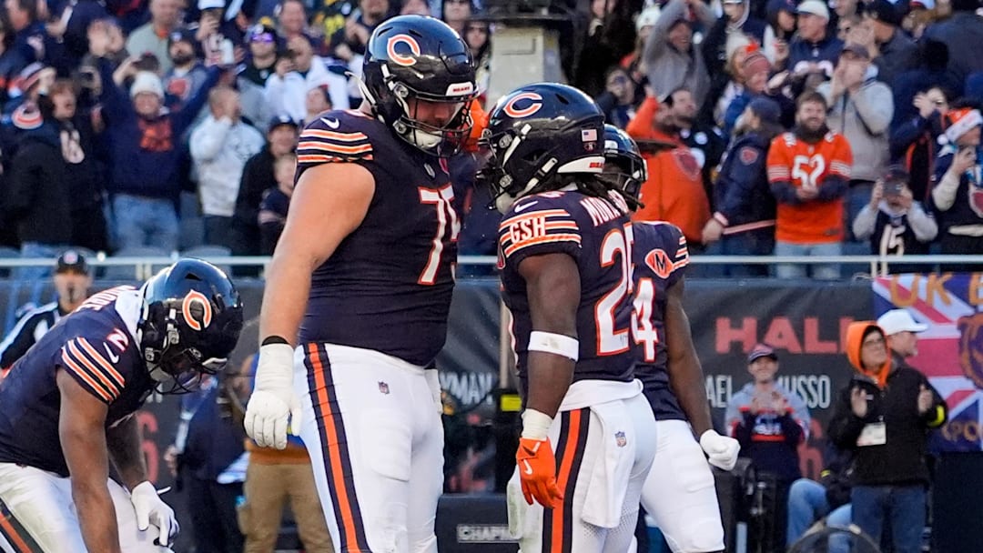 Nov 23, 2025; Chicago, Illinois, USA; Chicago Bears running back Kyle Monangai (25) reacts with offensive tackle Ozzy Trapilo (75) after scoring a touchdown against the Pittsburgh Steelers during the second half at Soldier Field. Mandatory Credit: David Banks-Imagn Images