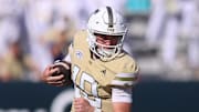 Oct 25, 2025; Atlanta, Georgia, USA; Georgia Tech Yellow Jackets quarterback Haynes King (10) runs the ball against the Syracuse Orange in the fourth quarter at Bobby Dodd Stadium at Hyundai Field. Mandatory Credit: Brett Davis-Imagn Images