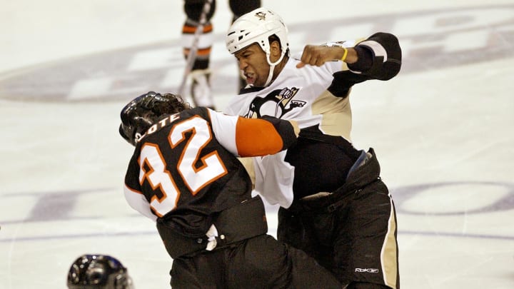 January 24, 2008; Philadelphia, PA USA;  Pittsburgh Penguins right wing Georges Laraque (27) fights Philadelphia Flyers left wing Riley Cote (32) during game at the Wachovia Center. Mandatory Credit: Eric Hartline-USA TODAY Sports
