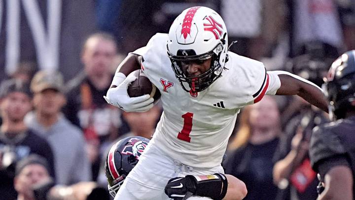 Yukon's Daniel Yebit tries to get by Mustang's Josiah Stevens during the high school game between Mustang and Yukon at Mustang High School in Mustang, Okla., Friday, Sept. 5, 2025.