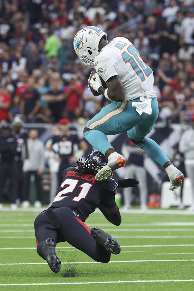 Miami Dolphins wide receiver Tyreek Hill makes a reception as Houston Texans safety Calen Bullock.