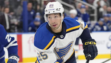 Oct 24, 2024; Toronto, Ontario, CAN; St. Louis Blues forward Jordan Kyrou (25) skates against the Toronto Maple Leafs during the second period at Scotiabank Arena. Mandatory Credit: John E. Sokolowski-Imagn Images