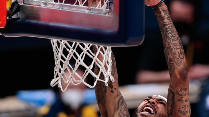 Mar 21, 2021; Denver, Colorado, USA; New Orleans Pelicans forward Brandon Ingram (14) dunks the ball in the third quarter against the Denver Nuggets at Ball Arena. Mandatory Credit: Isaiah J. Downing-USA TODAY Sports