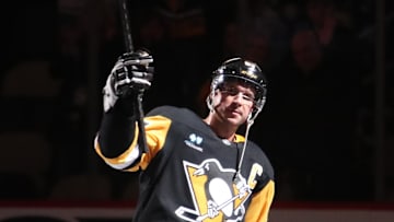 Dec 29, 2024; Pittsburgh, Pennsylvania, USA;  Pittsburgh Penguins center Sidney Crosby (87) reacts after being named first star of the game against the New York Islanders at PPG Paints Arena. Mandatory Credit: Charles LeClaire-Imagn Images