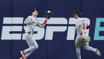 Sep 5, 2024; Pittsburgh, Pennsylvania, USA;  Washington Nationals center fielder Jacob Young (30) makes a catch for an out in front of right fielder Dylan Crews (3) against the Pittsburgh Pirates during the eighth inning at PNC Park. Mandatory Credit: Charles LeClaire-Imagn Images