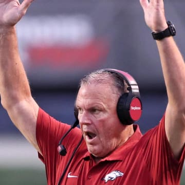 Arkansas Razorbacks coach Sam Pittman signals a touchdown in the second quarter against UAPB at War Memorial Stadium.