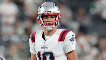 Sep 19, 2024; East Rutherford, New Jersey, USA; New England Patriots quarterback Drake Maye (10) stands behind center during the fourth quarter against the New York Jets at MetLife Stadium. Mandatory Credit: Brad Penner-Imagn Images