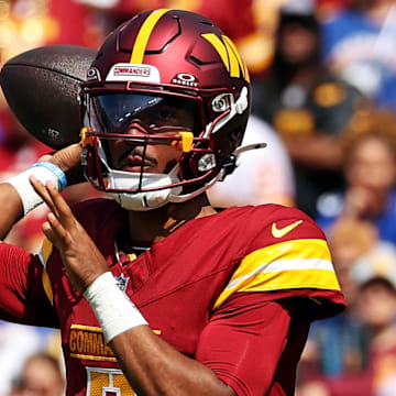 Sep 15, 2024; Landover, Maryland, USA; Washington Commanders quarterback Jayden Daniels (5) throws a pass during the first quarter against the New York Giants at Commanders Field. Mandatory Credit: Peter Casey-Imagn Images