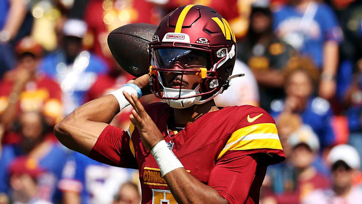 Sep 15, 2024; Landover, Maryland, USA; Washington Commanders quarterback Jayden Daniels (5) throws a pass during the first quarter against the New York Giants at Commanders Field. Mandatory Credit: Peter Casey-Imagn Images