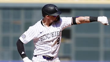 Apr 10, 2025; Denver, Colorado, USA; Colorado Rockies outfielder Brenton Doyle (9) reacts after a two run double against the Milwaukee Brewers  at Coors Field. Mandatory Credit: Ron Chenoy-Imagn Images
