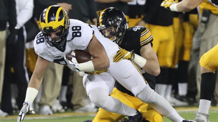 Nov 12, 2016; Iowa City, IA, USA; Iowa Hawkeyes linebacker Ben Niemann (44) tackles Michigan Wolverines tight end Jake Butt (88) during the first half at Kinnick Stadium. Mandatory Credit: Reese Strickland-USA TODAY Sports