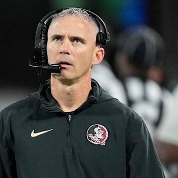 Dec 2, 2023; Charlotte, NC, USA;  Florida State Seminoles head coach Mike Norvell walks the sidelines during the third quarter against the Louisville Cardinals at Bank of America Stadium. Mandatory Credit: Jim Dedmon-Imagn Images