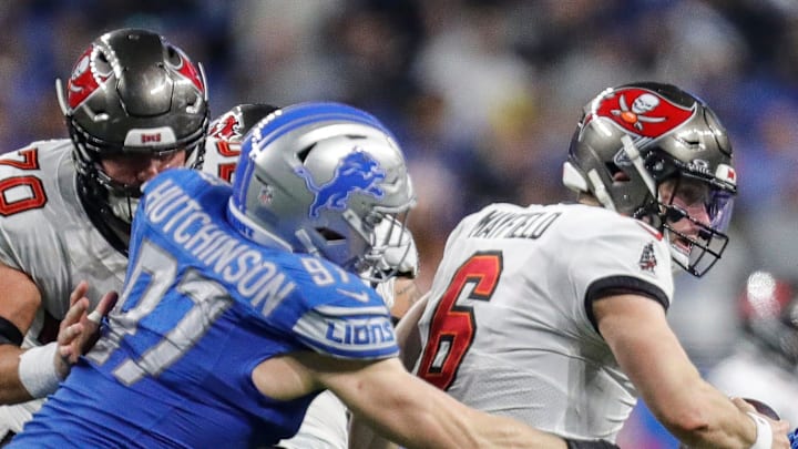 Jan 21, 2024; Detroit, Michigan, USA; Detroit Lions defensive end Aidan Hutchinson (97) tackles Tampa Bay Buccaneers quarterback Baker Mayfield (6) during the second half in a 2024 NFC divisional round game at Ford Field. Mandatory Credit: Junfu Han-Imagn Images