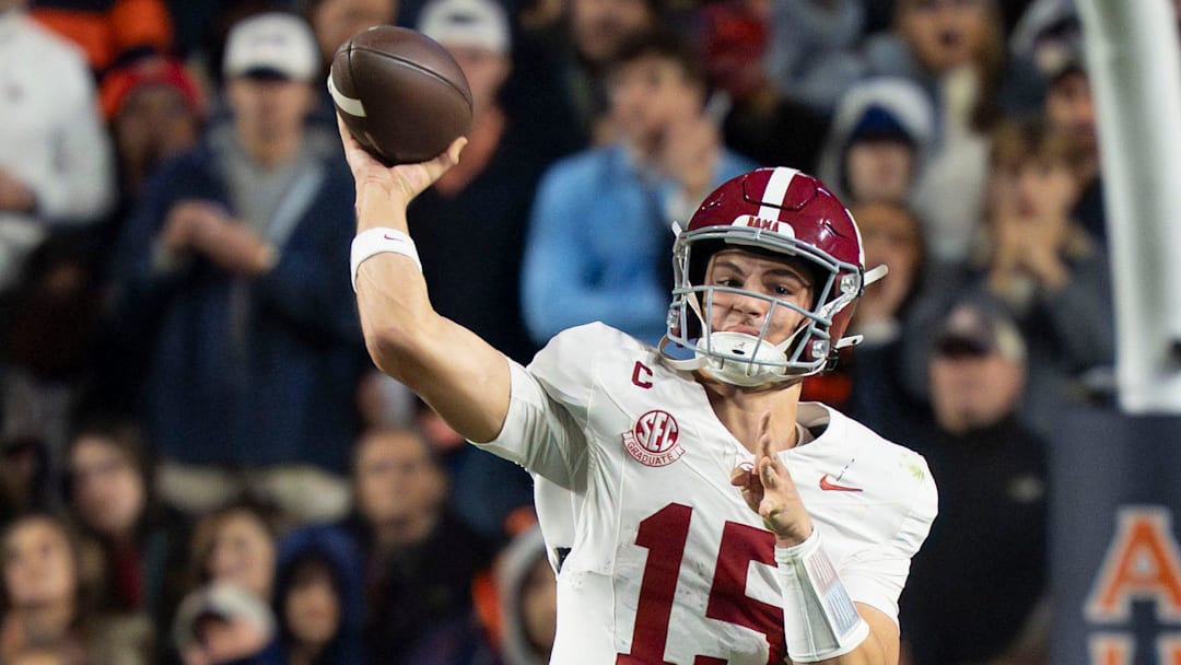 Nov 29, 2025; Auburn, Alabama, USA; Alabama quarterback Ty Simpson (15) throws a pass at Jordan-Hare Stadium. Alabama defeated Auburn 27-20. Mandatory Credit: Gary Cosby Jr.-Tuscaloosa News