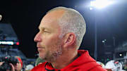Nov 21, 2024; Atlanta, Georgia, USA; Georgia Tech Yellow Jackets head coach Brent Key talks to North Carolina State Wolfpack head coach Dave Doeren after a game at Bobby Dodd Stadium at Hyundai Field. Mandatory Credit: Brett Davis-Imagn Images

