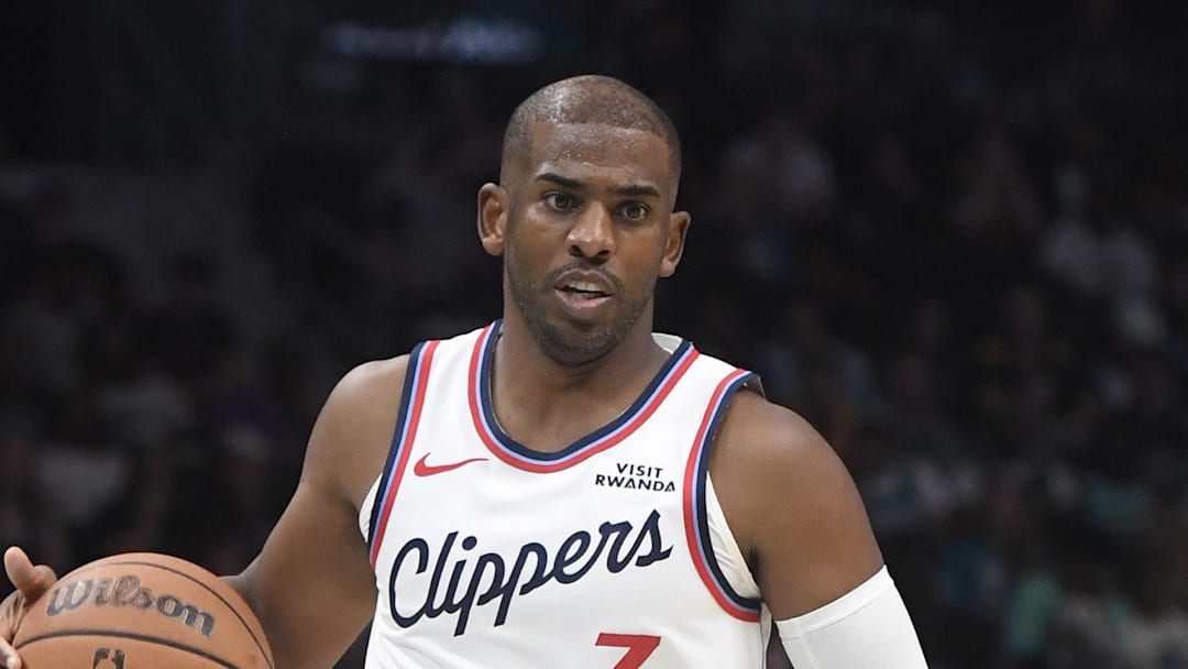 Nov 22, 2025; Charlotte, North Carolina, USA; Los Angeles Clippers guard Chris Paul (3) drives in during the second half against the Charlotte Hornets at the Spectrum Center. Mandatory Credit: Sam Sharpe-Imagn Images