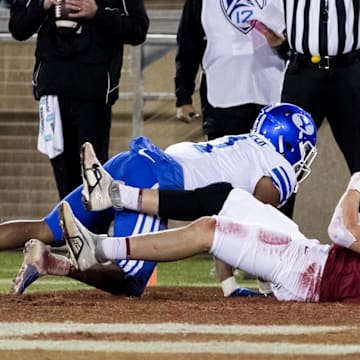 Nov 26, 2022; Stanford, California, USA;  Stanford Cardinal tight end Benjamin Yurosek (84) scores a touchdown against Brigham Young Cougars defensive back Micah Harper (1) during the second half at Stanford Stadium.