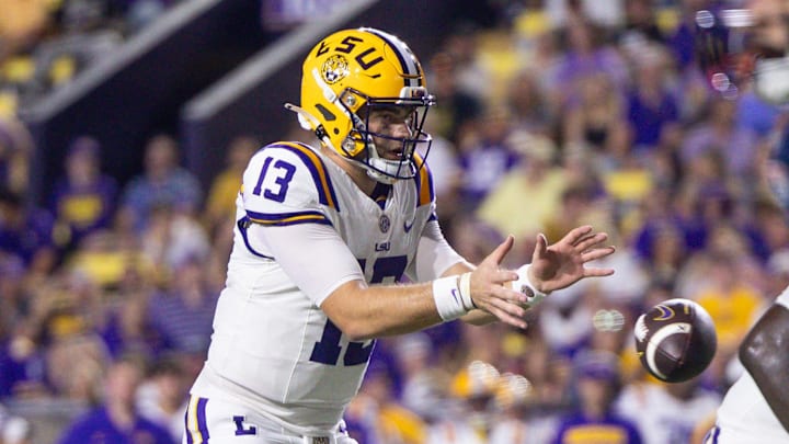 Sep 28, 2024; Baton Rouge, Louisiana, USA;  LSU Tigers quarterback Garrett Nussmeier (13) catches a snap against the South Alabama Jaguars during the second quarter at Tiger Stadium. Mandatory Credit: Stephen Lew-Imagn Images