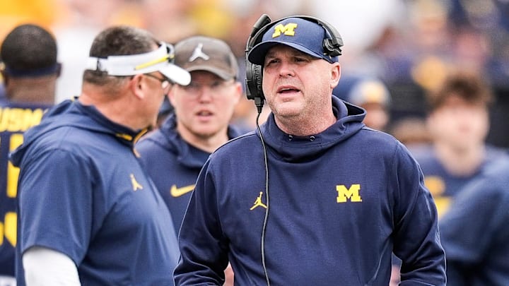 Michigan offensive coordinator Chip Lindsey talks to players on the sideline during the first half of the spring game at Michigan Stadium in Ann Arbor on Saturday, April 19, 2025.