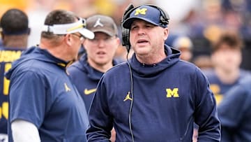 Michigan offensive coordinator Chip Lindsey talks to players on the sideline during the first half of the spring game at Michigan Stadium in Ann Arbor on Saturday, April 19, 2025.