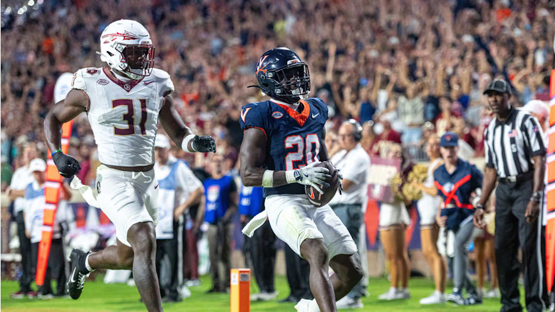 Virginia running back Xavier Brown hauls in a pass for a touchdown