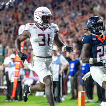 Virginia running back Xavier Brown hauls in a pass for a touchdown