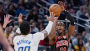 Nov 29, 2025; Indianapolis, Indiana, USA; Chicago Bulls guard Ayo Dosunmu (11) shoots the ball against Indiana Pacers guard Bennedict Mathurin (00) during the first half at Gainbridge Fieldhouse. Mandatory Credit: Trevor Ruszkowski-Imagn Images