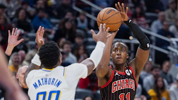 Nov 29, 2025; Indianapolis, Indiana, USA; Chicago Bulls guard Ayo Dosunmu (11) shoots the ball against Indiana Pacers guard Bennedict Mathurin (00) during the first half at Gainbridge Fieldhouse. Mandatory Credit: Trevor Ruszkowski-Imagn Images