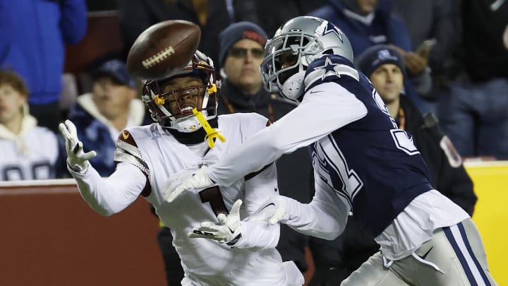 Jan 8, 2023; Landover, Maryland, USA; Washington Commanders wide receiver Jahan Dotson (1) attempts to catch a pass as Dallas Cowboys cornerback Trayvon Mullen (37) defends during the third quarter at FedExField. 