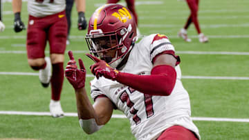 Dec 15, 2024; New Orleans, Louisiana, USA;  Washington Commanders wide receiver Terry McLaurin (17) celebrates a touchdown against the New Orleans Saints cornerback Kool-Aid McKinstry (14) during the first half at Caesars Superdome. Mandatory Credit: Matthew Hinton-Imagn Images