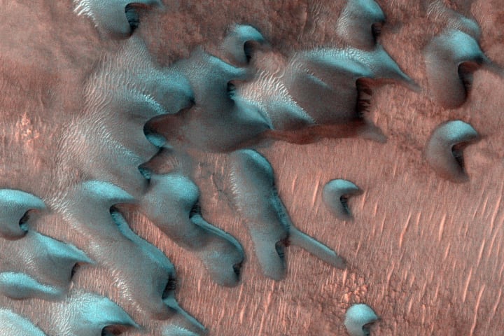 Colored image of frosted sand dunes far north of the Martian equator