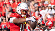 Louisville Cardinals tight end Jamari Johnson (11) celebrates his play during their game against the Jacksonville State Gamecocks.
