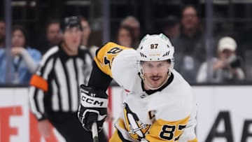 Jan 29, 2025; Salt Lake City, Utah, USA; Pittsburgh Penguins center Sidney Crosby (87) skates with the puck against the Utah Hockey Club during the third period at Delta Center. Mandatory Credit: Rob Gray-Imagn Images