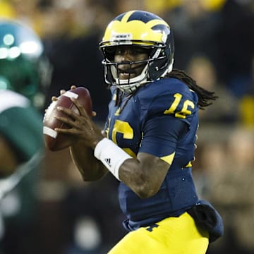 October 20, 2012; Ann Arbor, MI, USA; Michigan Wolverines quarterback Denard Robinson (16) drops back to pass in the fourth quarter against the Michigan State Spartans at Michigan Stadium. Michigan won 12-10. Mandatory Credit: Rick Osentoski-Imagn Images