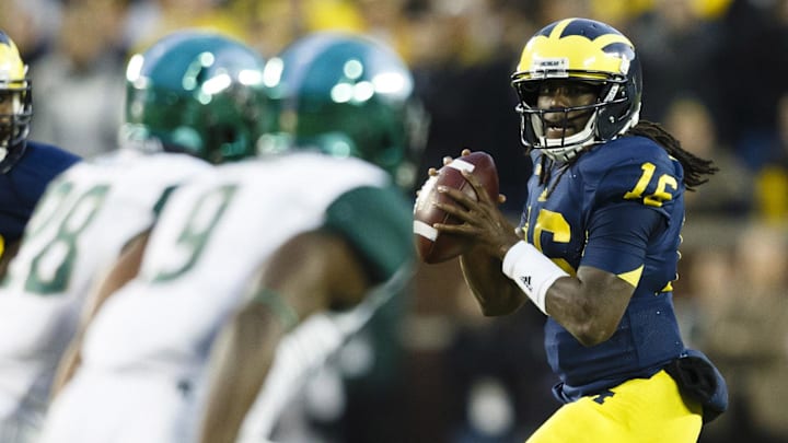 October 20, 2012; Ann Arbor, MI, USA; Michigan Wolverines quarterback Denard Robinson (16) drops back to pass in the fourth quarter against the Michigan State Spartans at Michigan Stadium. Michigan won 12-10. Mandatory Credit: Rick Osentoski-Imagn Images