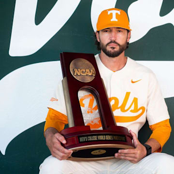 Tennessee baseball head coach Tony Vitello, Knox News Sportsperson of the Year, poses for a portrait with the team's 2021 College World Series participant trophy at Lindsey Nelson Stadium in Knoxville, Tenn. on Thursday, Dec. 16, 2021.